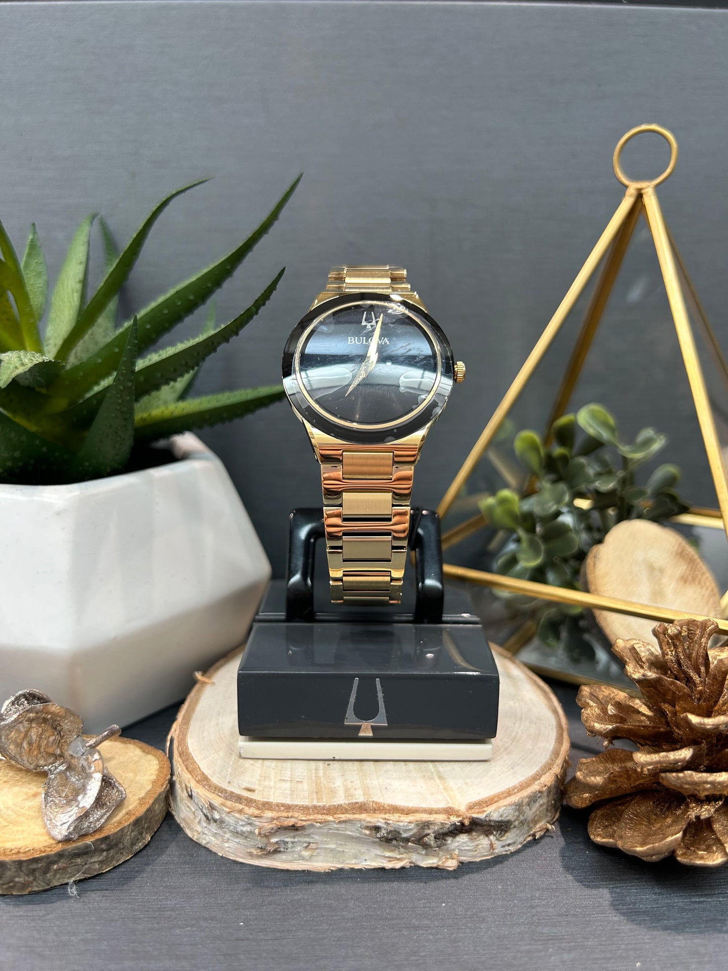 Women's Bulova Gold Dial Plain Black Face Watch with Metal Band