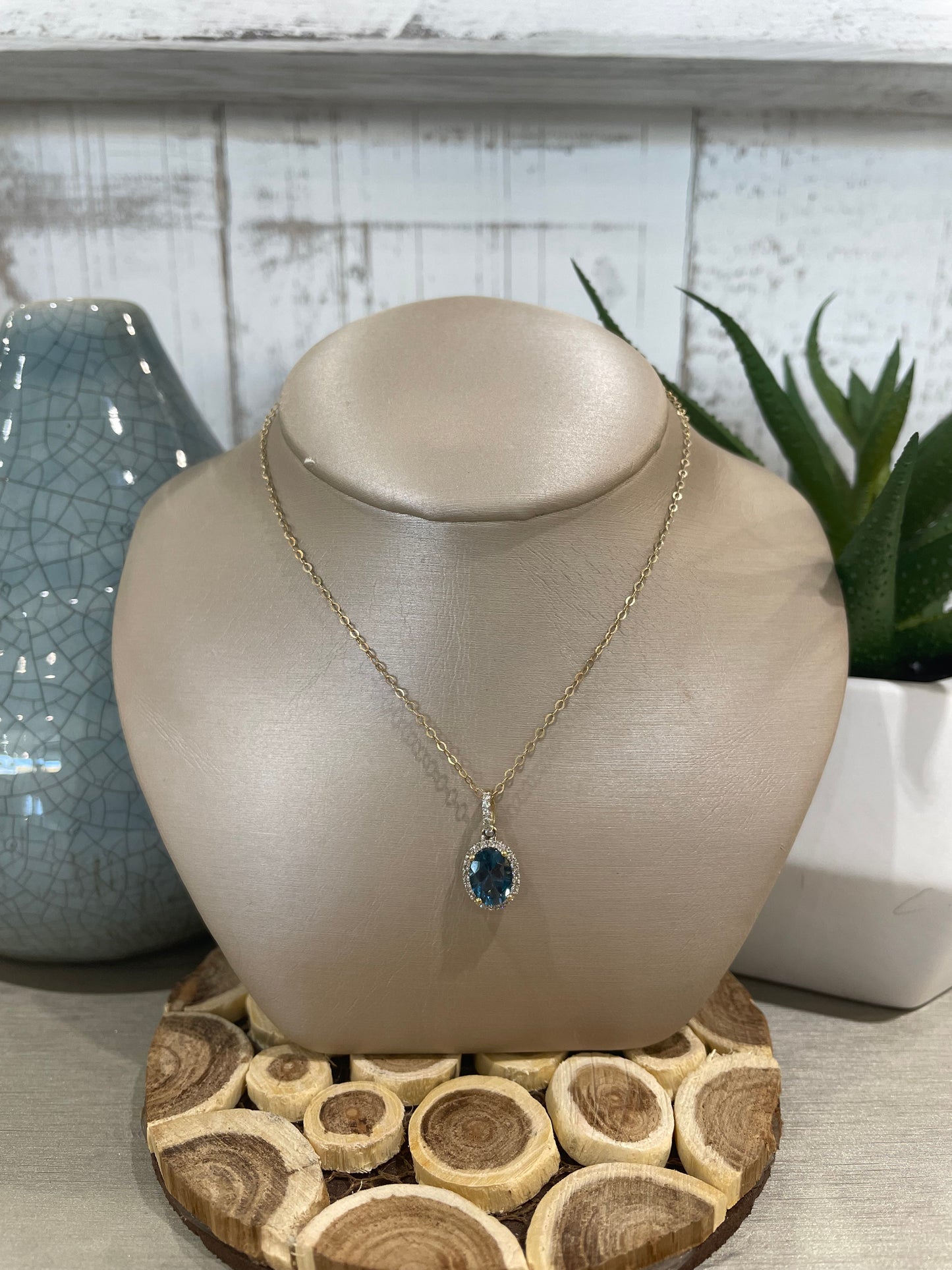 10k Yellow Gold Oval London Blue Topaz Halo Pendant