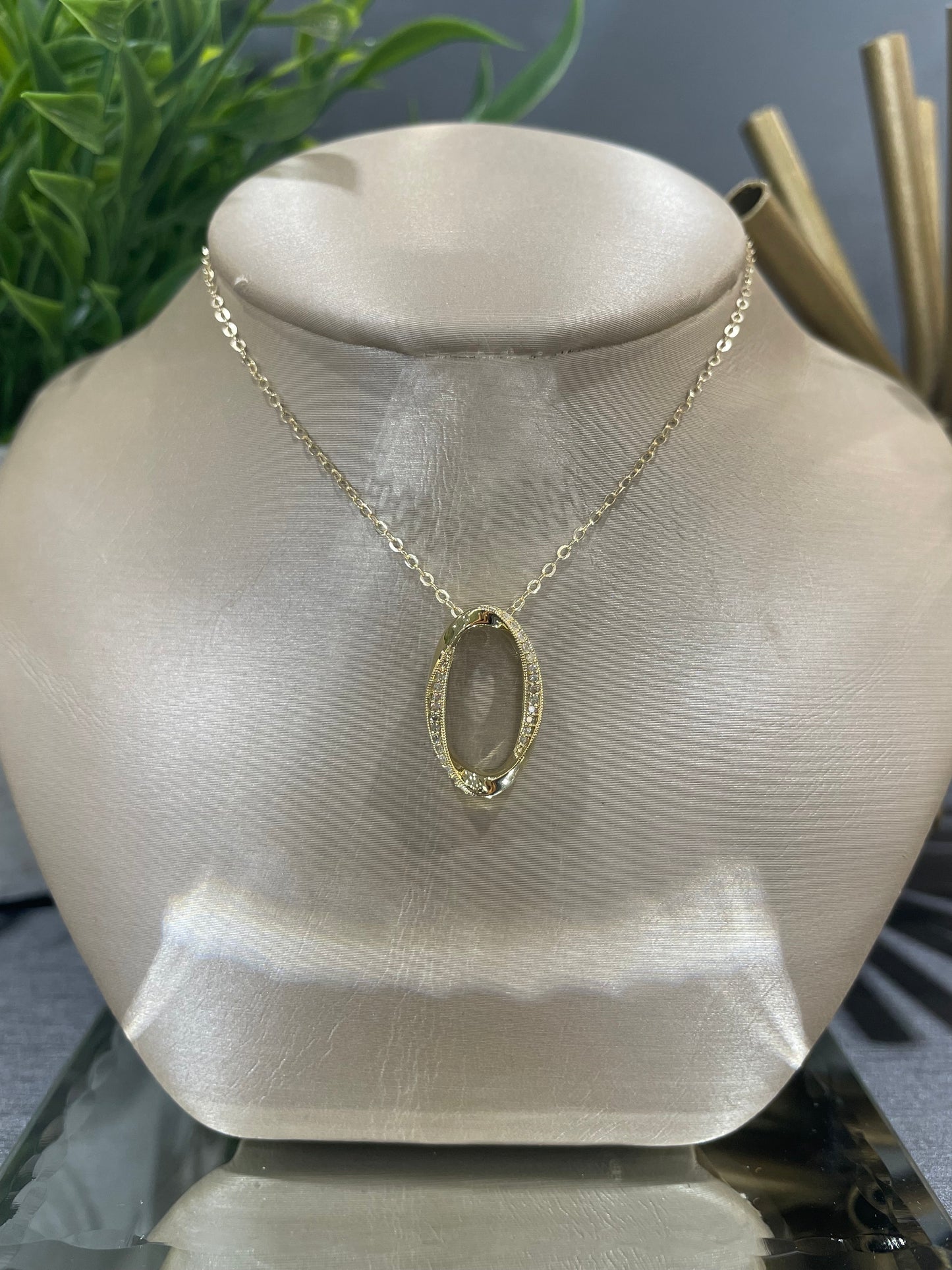 10k Yellow Gold 0.10ctw Diamond Oval Wrap Detail Pendant